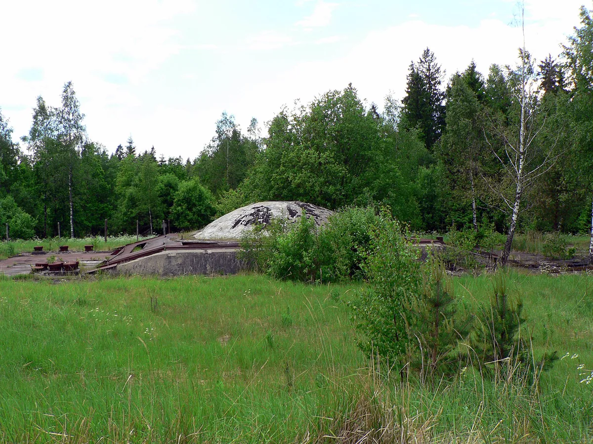 The cupola of an underground R-12U nuclear missile silo in Plokštinė forest base, Lithuania. The cover could slide away on the rails or just blow off before a missile launch. Author: Wojsyl , 2006.